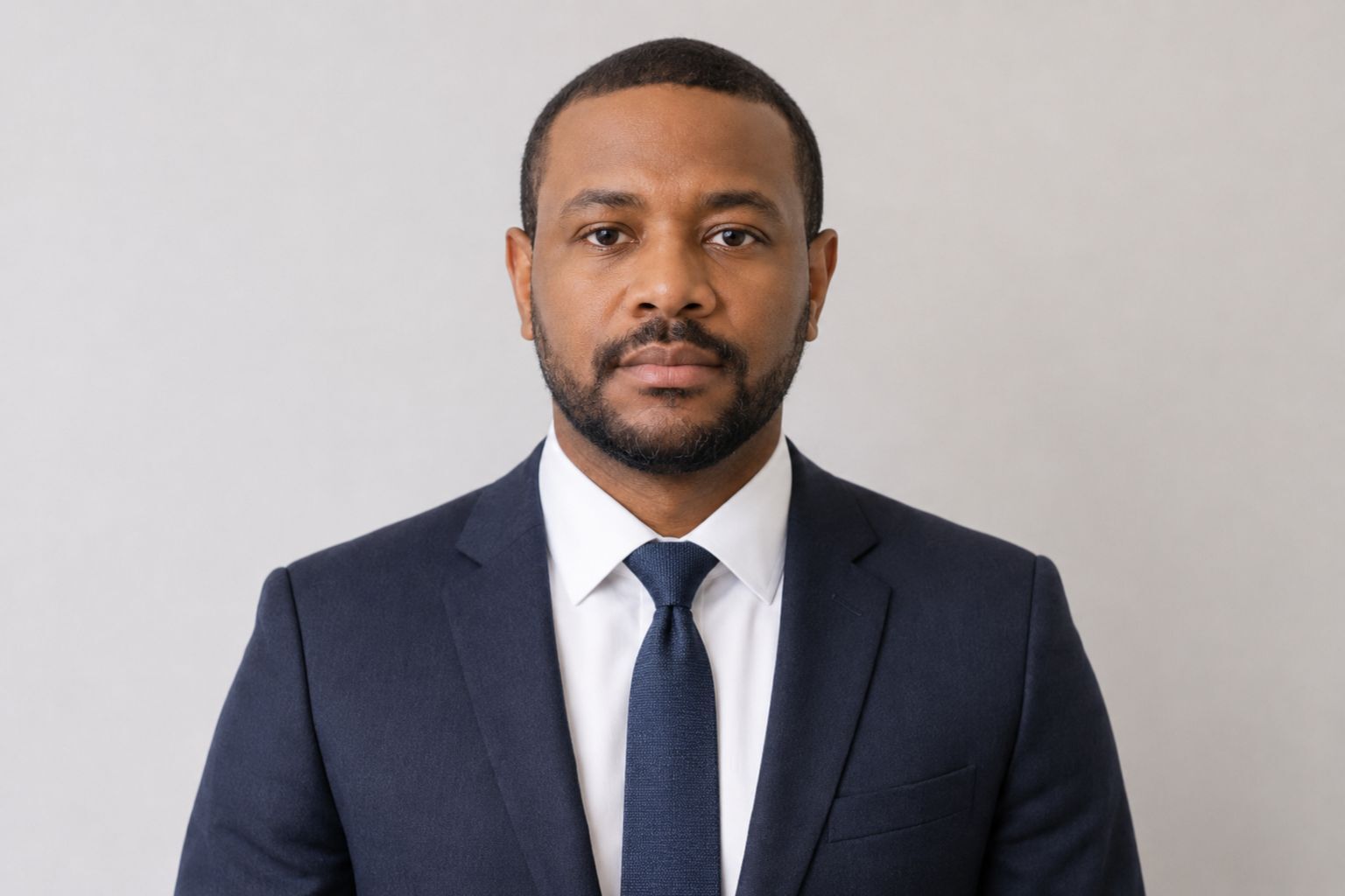 Daniel Okoro, Analytics Engineering Consultant at Data Science Consulting Pro, shown in a professional business portrait wearing a suit, white shirt, and tie.